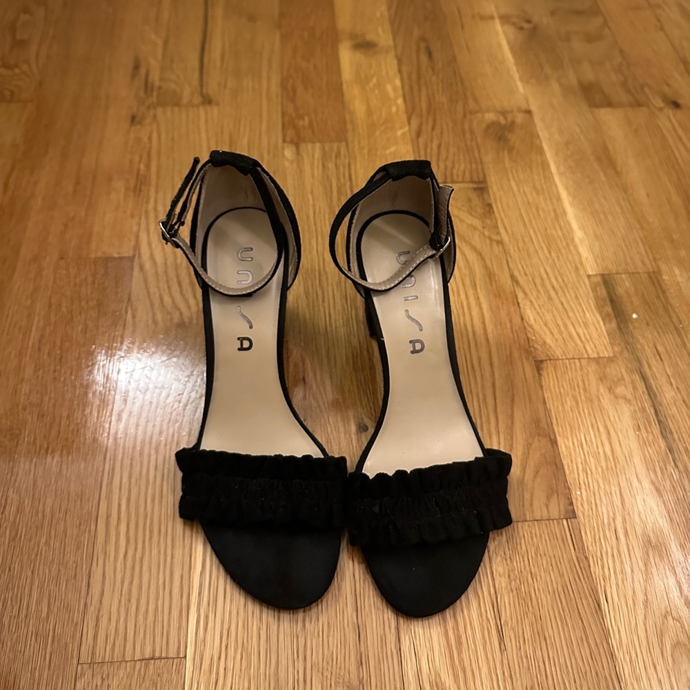 Unisa Elegant Black Ruffle Ankle Strap Heels